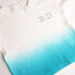 Tye die t-shirt in blue and white with embroidered initials on the front.